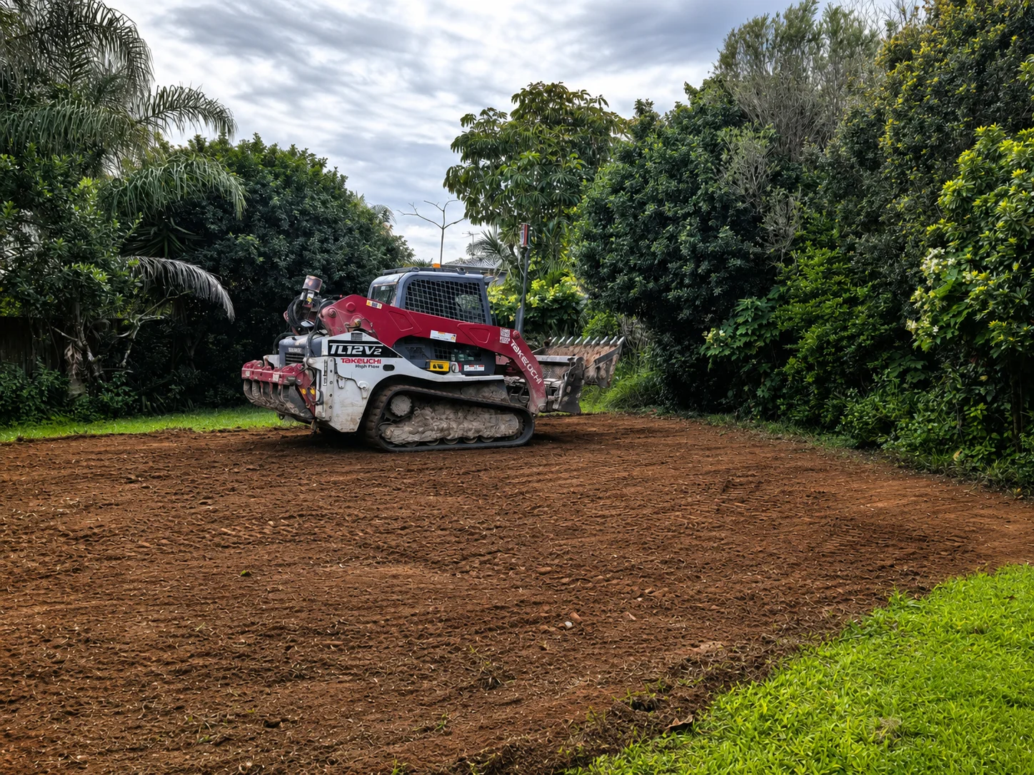Track loader levelling the site at the start of construction — 10 July 2026 · Construction start · Site levelling